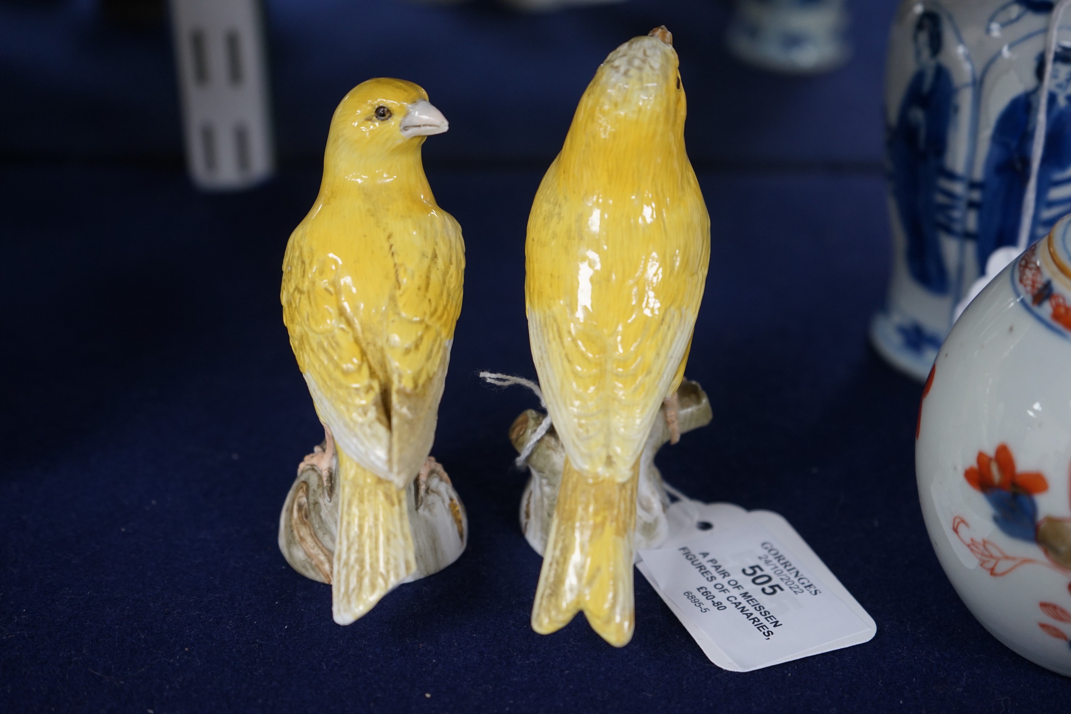 A pair of Meissen figures of canaries, 10cm tall